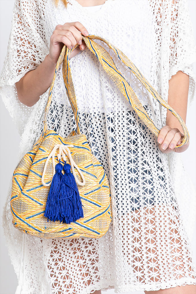SOLID BUCKET BAG WITH AZTEC STRAP