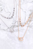 DOUBLE RING TWISTED PENDANT MULTI CHAIN LAYERED BRASS NECKLACE AND EARRING SET