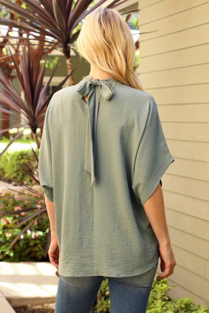 Back Ribbon Detail Turtle Neckline Dolman Top
